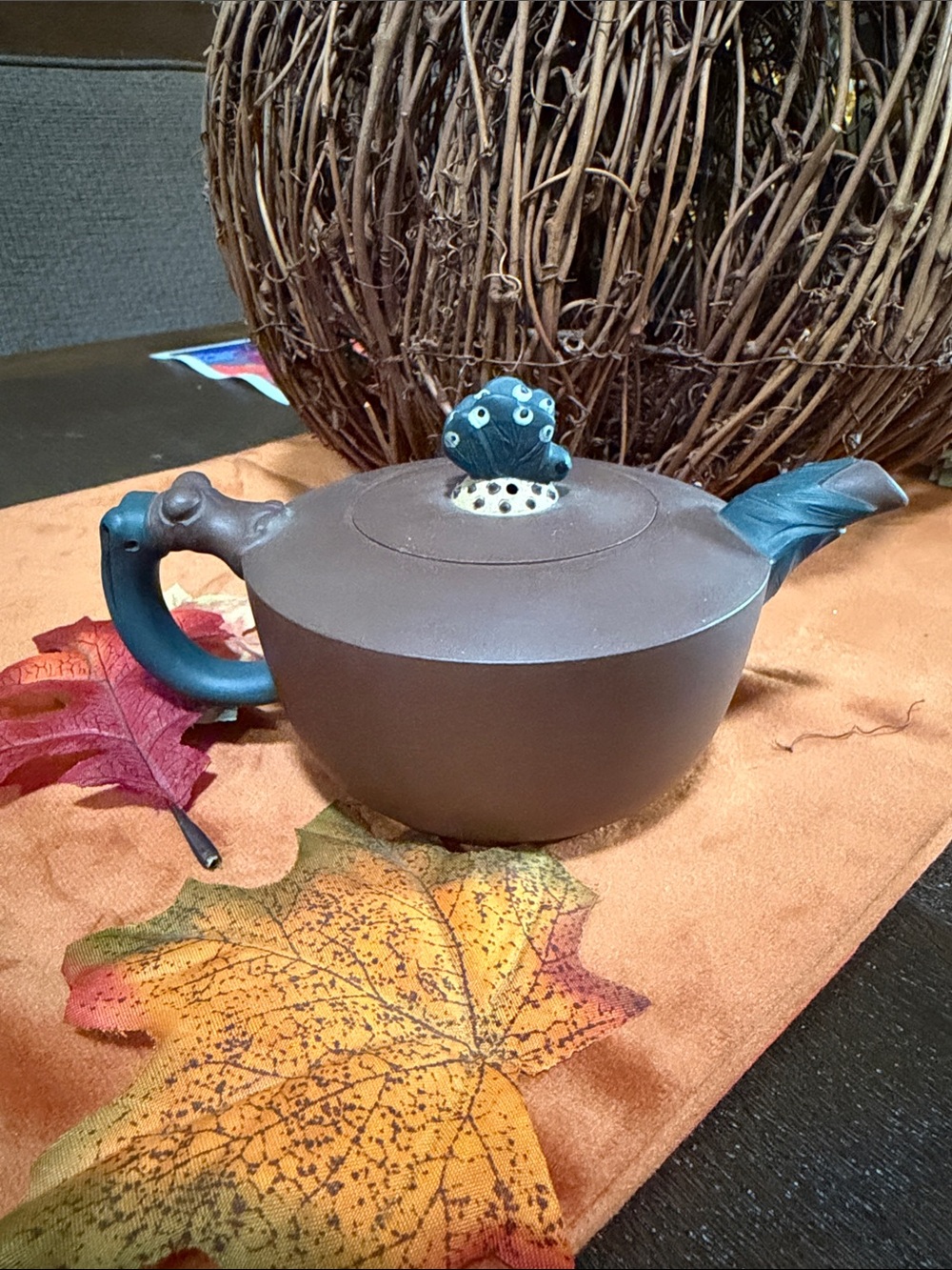 Handcrafted Brown Butterfly Ceramic Teapot with Blue Handle and Spout Accent